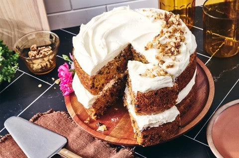 Gluten-Free Carrot Cake with Cream Cheese Frosting with a slice cut out