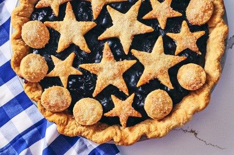 Fresh Blueberry Pie in a pan; shot from overhead