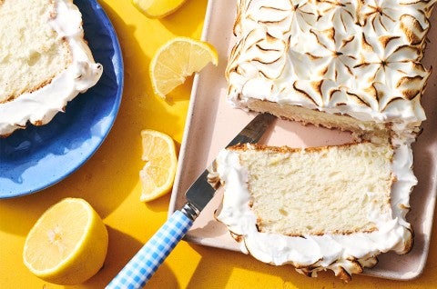 Lemon Angel Food Cake with Meringue Topping sliced on a serving tray