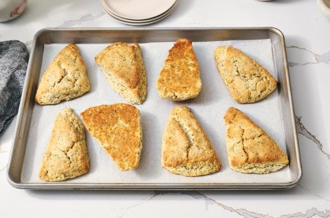 Lemon poppy seed scones baked on nested sheet pans