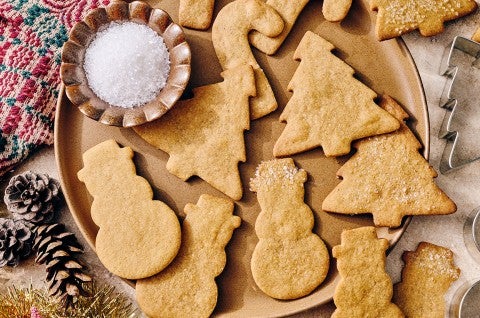 Light Spice Holiday Cookies on a plate with decorative holiday accents.