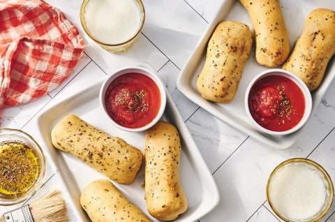 Cheese Stuffed Breadsticks arranged on plates.