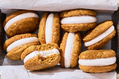 Oatmeal Cream Pies in a basket showing one with a bite taken out.