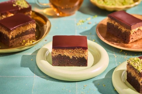 Dubai Chocolate Brownies on plates arranged on a counter