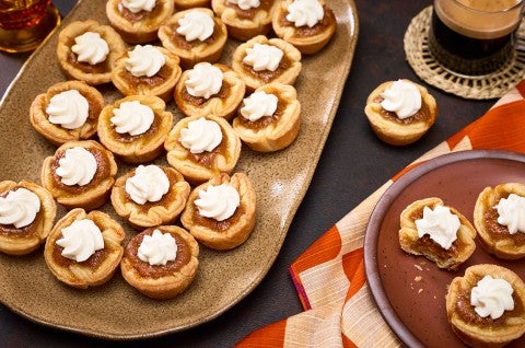 Mini Pumpkin Pies arranged no plates