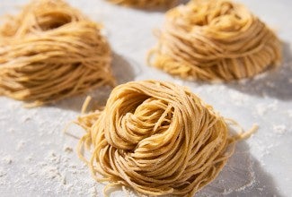 Whole Wheat Pasta nests on parchment