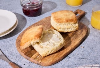 Small-Batch Biscuits on a cutting board with butter