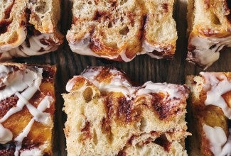 Cinnamon Roll Focaccia laid out on a cutting board