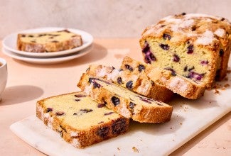 Blueberry Bread sliced on a cutting board