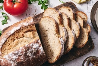 Caraway Rye Bread sliced on a cutting board