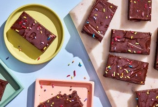 Homemade Cosmic Brownies served on plates and cutting board