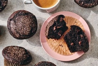 A Chocolate Breakfast Muffin broken open on a plate