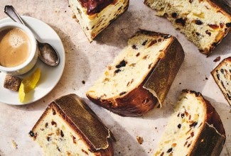 Overnight Panettone sliced and arranged on a counter seen from above.