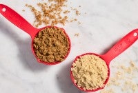Measuring cups with light and dark brown sugar