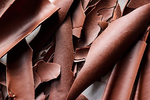 Strips of chocolate shaved into bark-like curls.