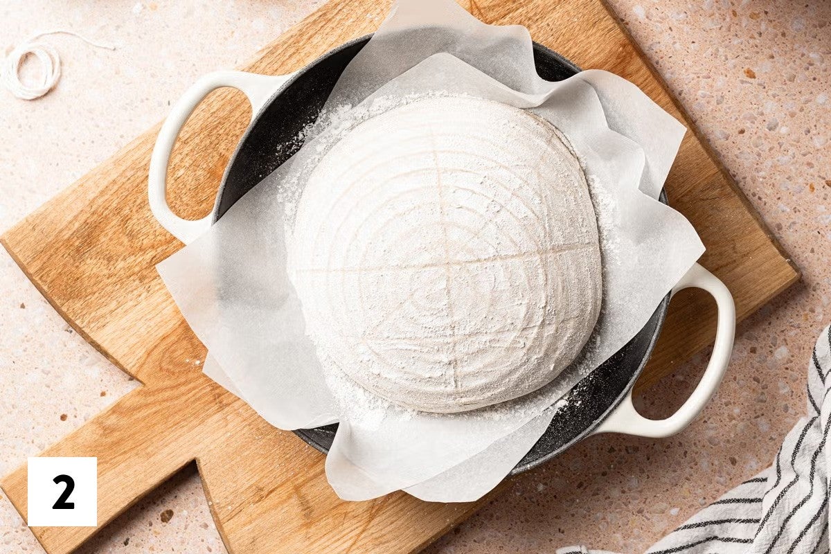 Loaf of sourdough bread loaf divided into 8 sections, with a square in the center