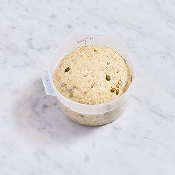 Multigrain Protein Bread dough in a bowl after rising.