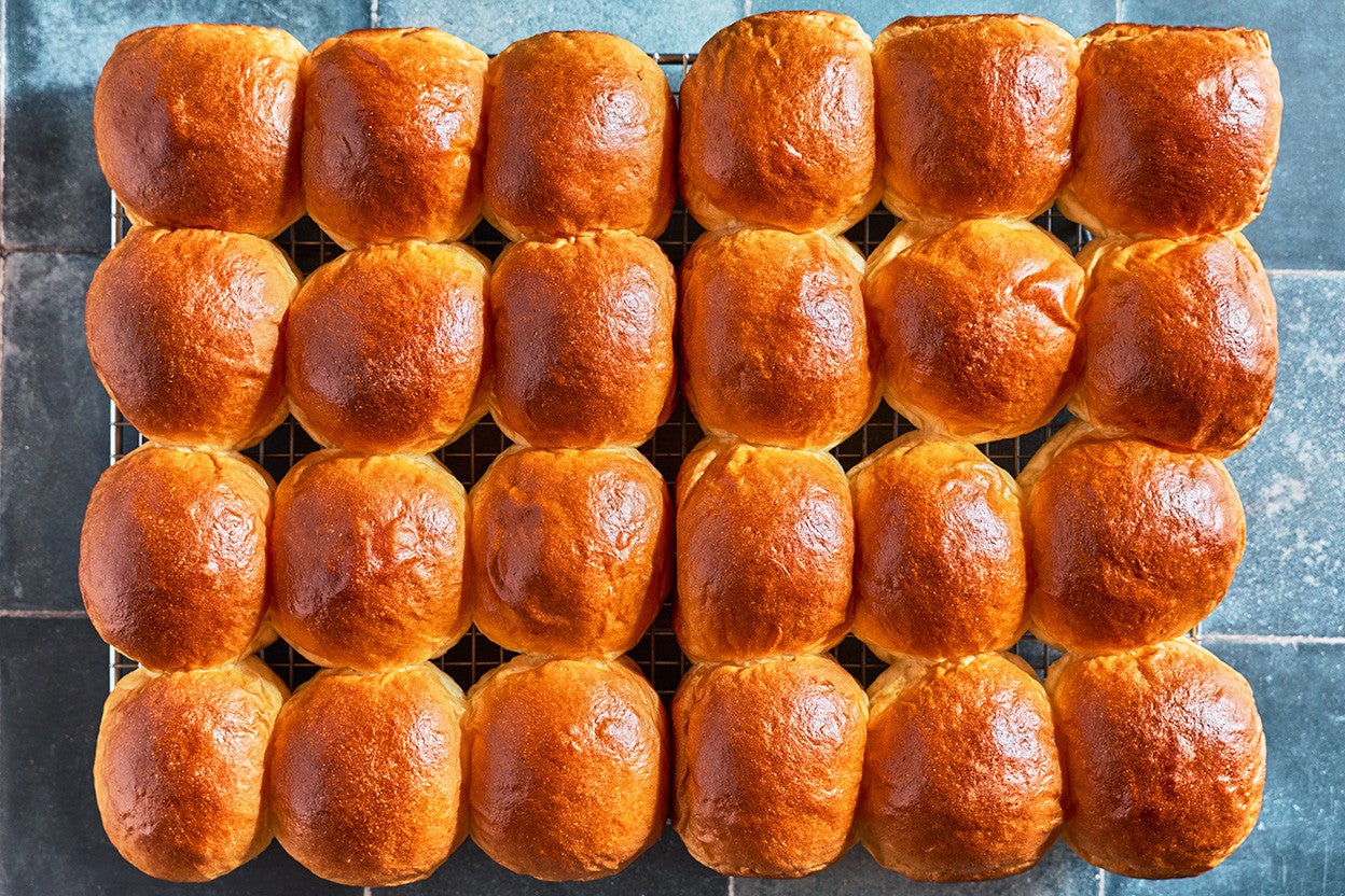 Big Batch Milk Bread Rolls arranged together on a counter