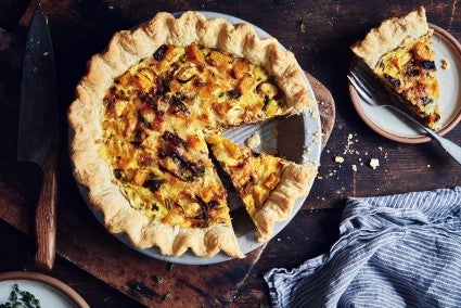 Photo of Roasted Butternut Squash & Spinach Quiche with slice taken out.