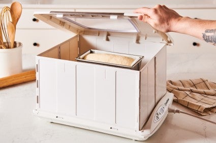 Folding bread proofer with bread dough inside