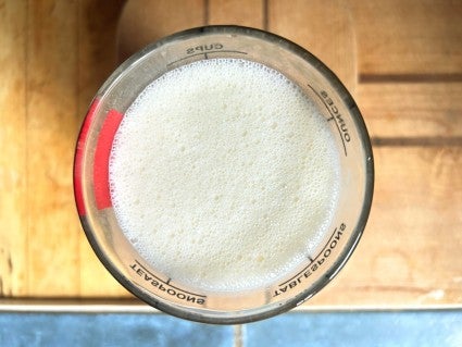 Milk and butter heated together and then whipped to a froth, to emulsify.