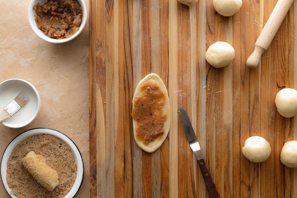 Seniorita bread dough that is spread with bread crumbs and ready to be rolled up