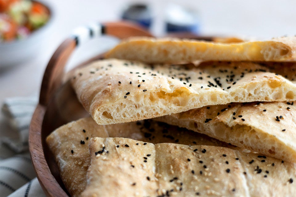 A crumb shot of a slice of Afghan naan