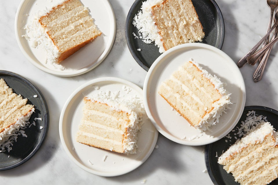 Slices of Coconut Layer Cake on plates