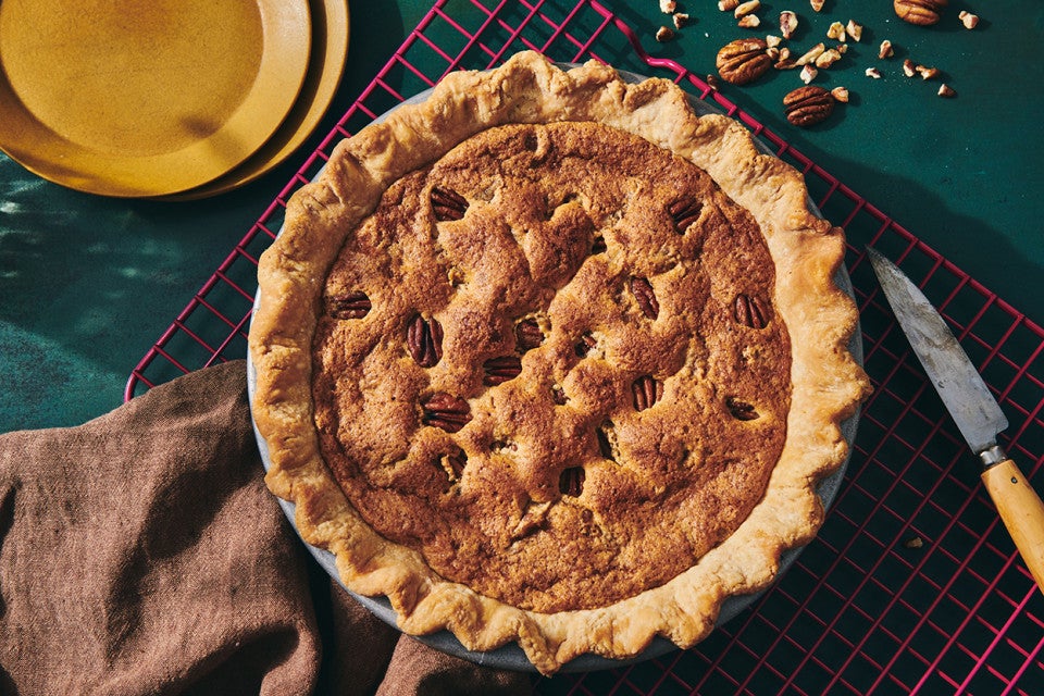 A Chocolate Chip Pecan Pie, freshly baked and on a kitchen table