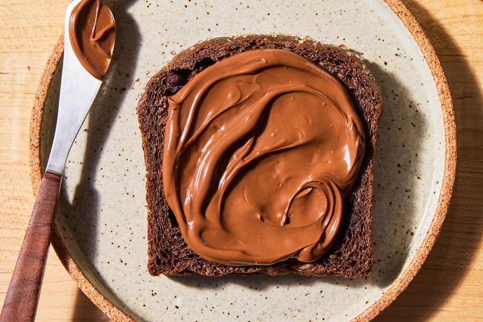A slice of Chocolate Milk Bread with Chocolate-Hazelnut spread
