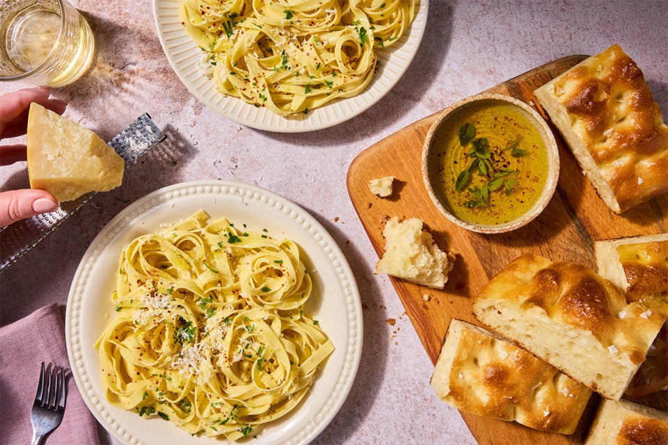 Golden Durum Pasta on a plate served with bread and soup