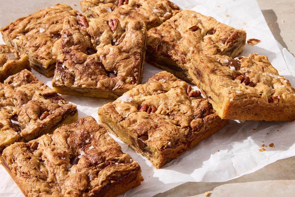 Banana Bread Bars cut up on parchment paper