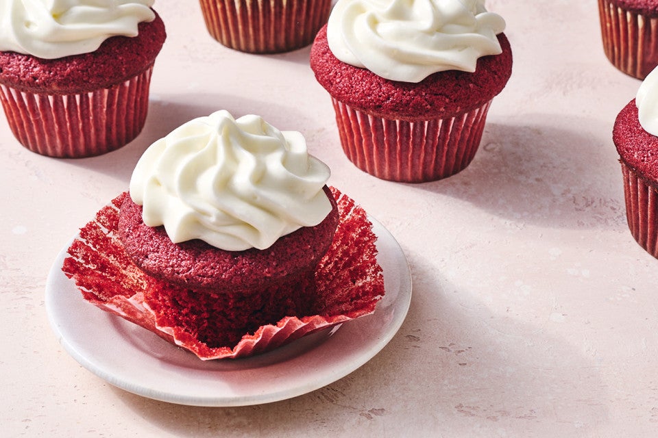 Red Velvet Cupcakes, one with the wrapper undone