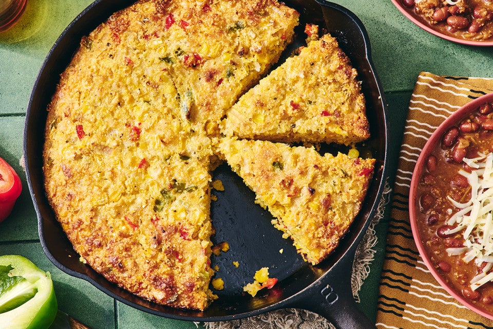 Sopa Paraguaya cut up in a cast iron pan