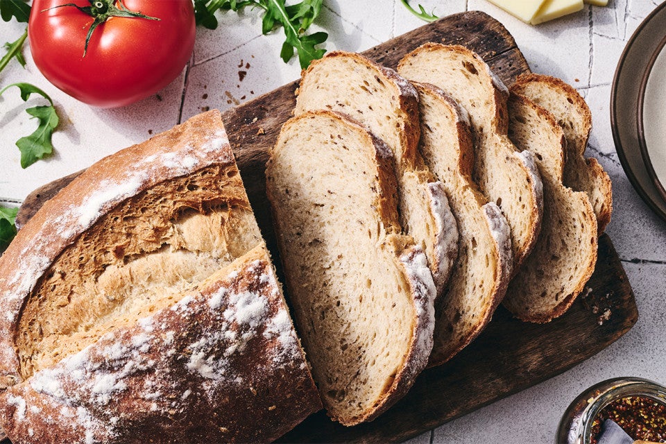 Caraway Rye Bread sliced on a cutting board
