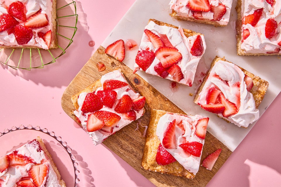Giant Strawberry Shortcake sliced on a cutting board