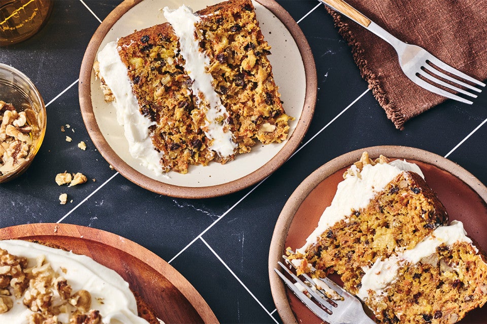 Slices of Gluten-Free Carrot Cake with Cream Cheese Frosting on plates