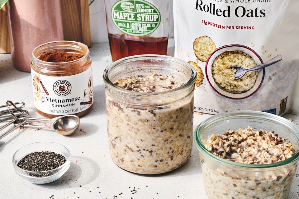 Simple Overnight Oats in jars and the ingredients to make them nearby