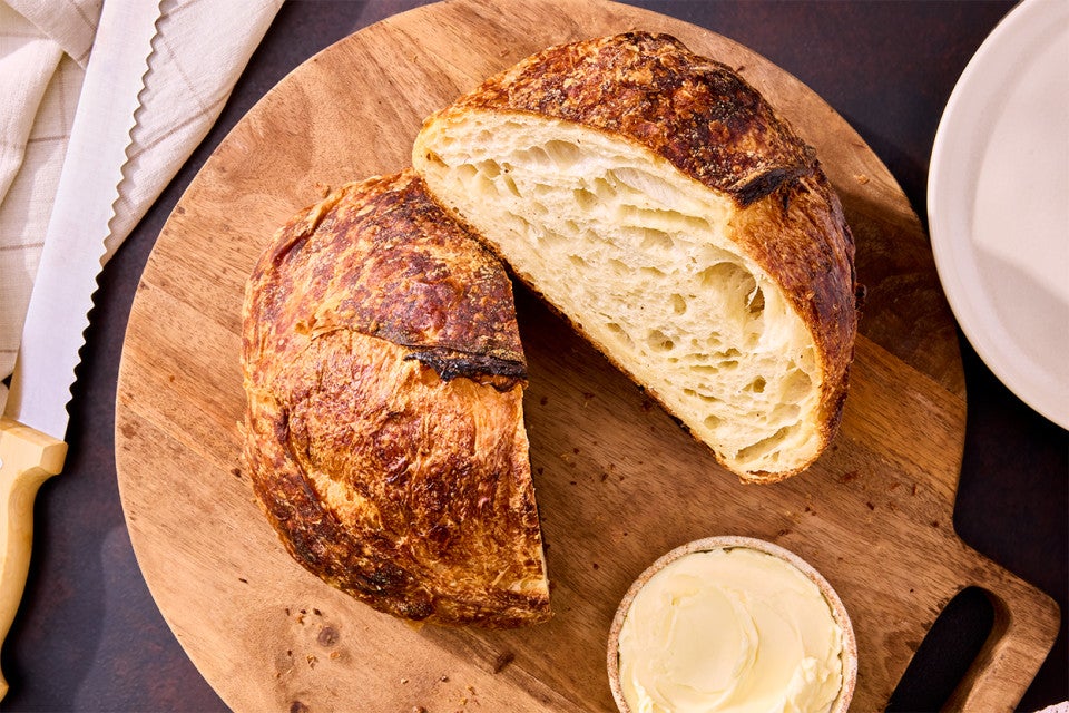 Croissant Sourdough Bread sliced and on a cutting board
