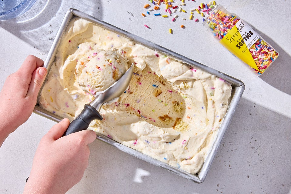 Scooping Birthday Cake Ice Cream out of the container