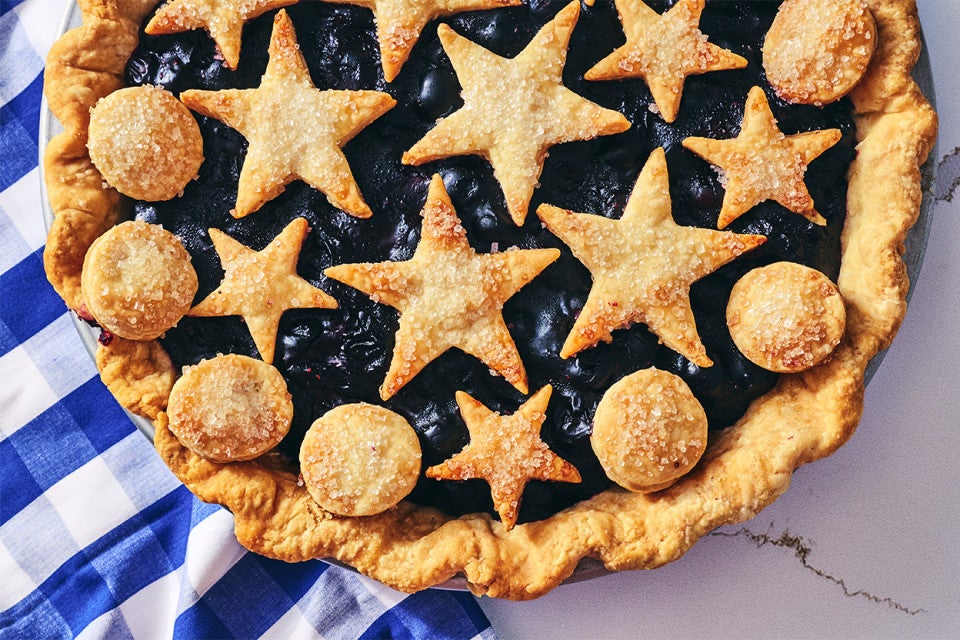 Fresh Blueberry Pie in a pan; shot from overhead