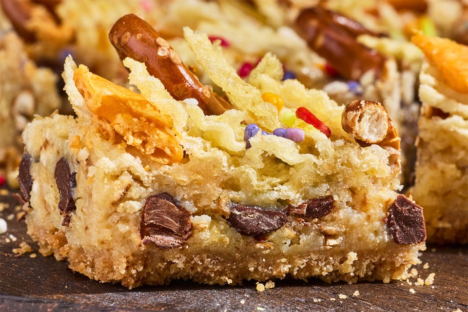 A Kitchen Sink Cookie Bar photographed from the side to show the interior