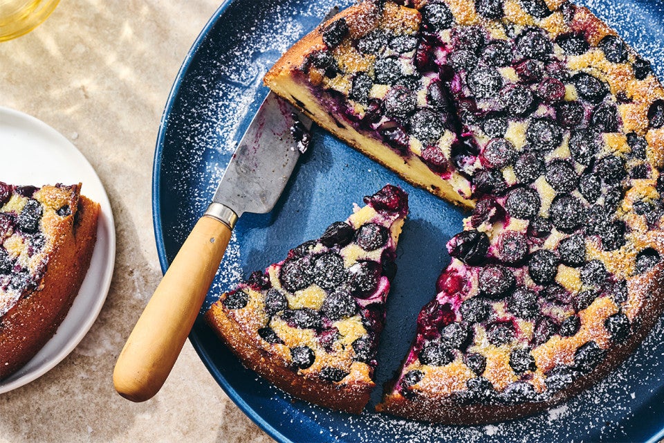 A sliced-up Blueberry Breakfast Cake on a plate