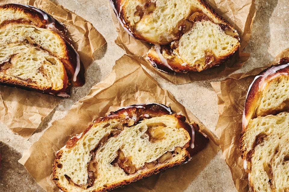 Slices of Cinnamon Apple Twist Bread on parchment paper