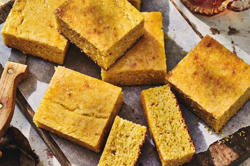Pieces of Maple Cornbread on a cutting board