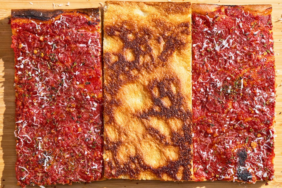 Top down photograph of Rhode Island Pizza Strip showing the middle slice bottom up with golden brown baked tones.