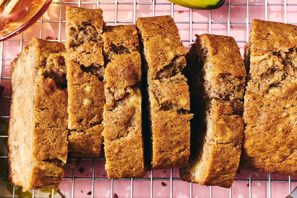 A loaf of Sourdough Banana Bread on a countertop sliced and seen from above.