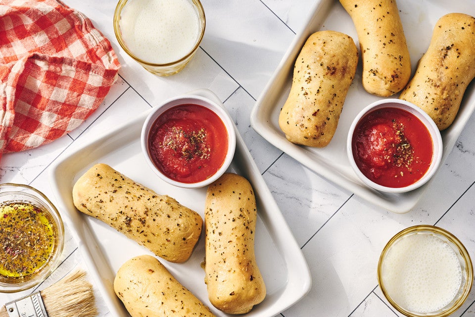 Cheese Stuffed Breadsticks arranged on plates.