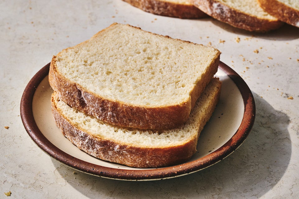 Two slices of classic sandwich bread on a plate.