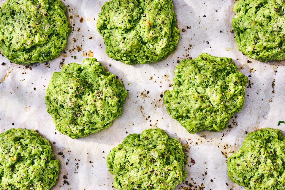 Green Goddess Herb Biscuits fresh out of the oven on parchment paper.